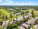 Stunning aerial view of the community showcasing lush landscaping, golf course, and beautiful homes at 10033 Hart Branch Cir, Orlando, FL 32832