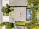 Birds-eye view of the home and lot featuring a screened-in pool and well-maintained surroundings at 10033 Hart Branch Cir, Orlando, FL 32832