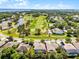 Community aerial shot, showing proximity to golf course, trees, and lake views at 10033 Hart Branch Cir, Orlando, FL 32832