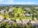 Neighborhood aerial shot featuring a golf course, lakes, and tree-lined streets at 10033 Hart Branch Cir, Orlando, FL 32832