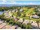 A golf course community with houses nestled among trees and adjacent to a lake at 10033 Hart Branch Cir, Orlando, FL 32832