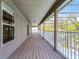 Extended balcony overlooking tropical landscape, offers serene and relaxing outdoor living space at 10033 Hart Branch Cir, Orlando, FL 32832