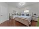 Charming bedroom with a light color scheme, hardwood flooring, and ample natural light at 10033 Hart Branch Cir, Orlando, FL 32832