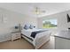 Bright bedroom with a ceiling fan, neutral walls, and view to the outside at 10033 Hart Branch Cir, Orlando, FL 32832