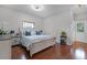 Calming bedroom with a striped bed set, hardwood flooring, and neutral paint at 10033 Hart Branch Cir, Orlando, FL 32832