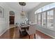 Tastefully designed dining room with hardwood floors, large windows, and an open view at 10033 Hart Branch Cir, Orlando, FL 32832