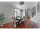 Elegant dining room featuring hardwood floors, a stylish chandelier, and a formal setting at 10033 Hart Branch Cir, Orlando, FL 32832