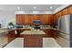 Well-equipped kitchen featuring granite counters, an island, and stainless steel appliances at 10033 Hart Branch Cir, Orlando, FL 32832