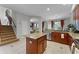 Well-lit kitchen featuring granite countertops, stainless steel appliances, and a functional island at 10033 Hart Branch Cir, Orlando, FL 32832