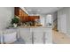 Open concept kitchen featuring granite countertop breakfast bar, stainless appliances, and tile floors at 10033 Hart Branch Cir, Orlando, FL 32832
