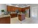 An open kitchen is equipped with stainless appliances, granite countertops, and a convenient center island at 10033 Hart Branch Cir, Orlando, FL 32832