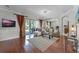 Inviting living room with an open layout, sliding doors to the patio, and hardwood flooring at 10033 Hart Branch Cir, Orlando, FL 32832