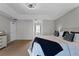 Tranquil main bedroom with a bed, view of ensuite, and access to the hallway at 10033 Hart Branch Cir, Orlando, FL 32832