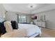 Inviting primary bedroom with a large bed, soft lighting, and a modern dresser at 10033 Hart Branch Cir, Orlando, FL 32832