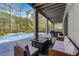 Outdoor patio boasts a lounge area and dining, perfectly complemented by a gorgeous pool at 10033 Hart Branch Cir, Orlando, FL 32832