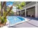 Luxurious screened pool area with lush landscaping provides a private, resort-like retreat at 10033 Hart Branch Cir, Orlando, FL 32832