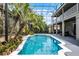 Beautiful in-ground pool with tropical landscaping and screened enclosure, blending indoor-outdoor living at 10033 Hart Branch Cir, Orlando, FL 32832