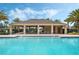 Community pool featuring a covered seating area with ceiling fans and ample lounge seating at 1021 Victoria Parc Ave, Orange City, FL 32763
