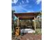 Comfortable pavilion with seating provides a relaxing outdoor space against a backdrop of lush foliage at 1021 Victoria Parc Ave, Orange City, FL 32763