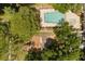 Community aerial view showcasing a playground, pool, and lush landscaping at 109 Romney Marsh Rd, Longwood, FL 32779