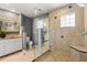 Bright bathroom featuring a glass shower, updated tiling and neutral wall paint at 109 Romney Marsh Rd, Longwood, FL 32779