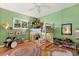 Unique bedroom with a bunk bed, green walls, a colorful rug and stuffed animals at 109 Romney Marsh Rd, Longwood, FL 32779