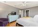 Bedroom with an ensuite featuring hardwood floors and a bright dresser at 109 Romney Marsh Rd, Longwood, FL 32779