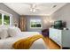 Cozy bedroom with hardwood floors, a ceiling fan, and great natural light at 109 Romney Marsh Rd, Longwood, FL 32779
