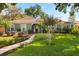 Charming single-story home featuring lush landscaping, a well-manicured lawn, and inviting curb appeal at 109 Romney Marsh Rd, Longwood, FL 32779