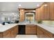 Spacious kitchen with light cabinets, white countertops, a backsplash, and modern appliances at 109 Romney Marsh Rd, Longwood, FL 32779