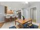 Kitchen and dining area with an island, light cabinets, and an open layout with tile floors at 109 Romney Marsh Rd, Longwood, FL 32779