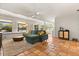 Bright living room with tile floors, white walls, modern furniture, and plenty of natural light at 109 Romney Marsh Rd, Longwood, FL 32779