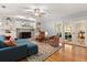 Inviting living room with fireplace, built-in shelves, and French doors to another room at 109 Romney Marsh Rd, Longwood, FL 32779
