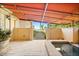 The backyard has a view of the lake and a covered patio with a hot tub at 1112 Orange Ave, Winter Springs, FL 32708