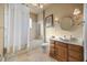 Bathroom featuring a shower-tub combo, and wooden vanity with a white sink at 1112 Orange Ave, Winter Springs, FL 32708
