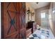 Bathroom featuring detailed cabinets, a black and white tiled floor, and a glass shower at 1112 Orange Ave, Winter Springs, FL 32708