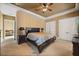 This is a cozy bedroom featuring a ceiling fan, a large bed, and a large closet, creating a comfortable and relaxing space at 1112 Orange Ave, Winter Springs, FL 32708