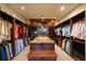 Spacious walk-in closet with custom shelving and ample storage for an organized wardrobe at 1112 Orange Ave, Winter Springs, FL 32708