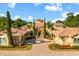 Stately home with circular driveway, fountain, and manicured landscaping, offering a luxurious and inviting curb appeal at 1112 Orange Ave, Winter Springs, FL 32708