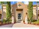 Elegant home entrance featuring detailed stonework, statues, and manicured landscaping, offering a luxurious and welcoming appeal at 1112 Orange Ave, Winter Springs, FL 32708