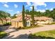 Spacious three-car garage with brick driveway and manicured landscaping at 1112 Orange Ave, Winter Springs, FL 32708