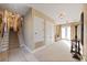 Hallway featuring a staircase with decorative runner, tile floors, and closet space at 1112 Orange Ave, Winter Springs, FL 32708