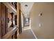 Hallway with a decorative wood door, neutral paint and carpet and views to the backyard at 1112 Orange Ave, Winter Springs, FL 32708