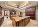 Expansive gourmet kitchen with custom wood cabinets, 2 islands, granite counters, and stainless appliances at 1112 Orange Ave, Winter Springs, FL 32708