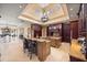 Expansive gourmet kitchen includes a large island, bar seating, and is open to the breakfast and living areas at 1112 Orange Ave, Winter Springs, FL 32708