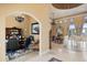 Elegant living room showcasing high ceilings, arched doorways, and luxury finishes, adjoining the office at 1112 Orange Ave, Winter Springs, FL 32708