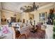 Luxurious living room with a unique ceiling design, comfortable seating, and sophisticated decor at 1112 Orange Ave, Winter Springs, FL 32708