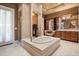 Elegant bathroom with tub, separate shower, and vanity area at 1112 Orange Ave, Winter Springs, FL 32708