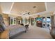 Spacious main bedroom with elegant decor, multiple windows, and serene lake views at 1112 Orange Ave, Winter Springs, FL 32708