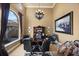 Executive home office with a large desk, custom cabinetry, and ample natural light from the large window at 1112 Orange Ave, Winter Springs, FL 32708